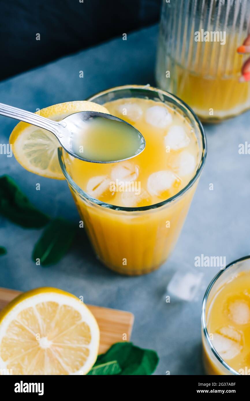 Lemonade In Closeup lemonade preparation process making hi-res stock photography ...