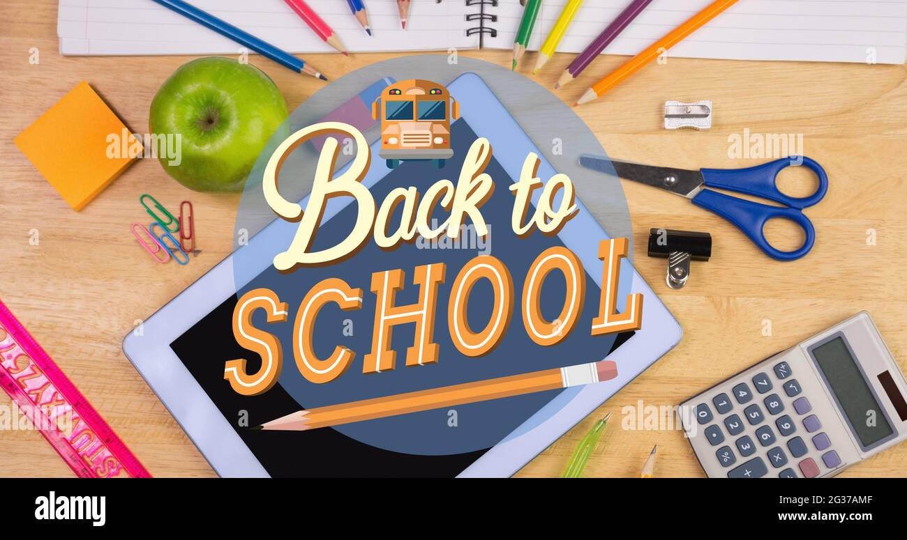 Composition of text back to school with pencil, over school stationery and equipment on wooden desk Stock Photo