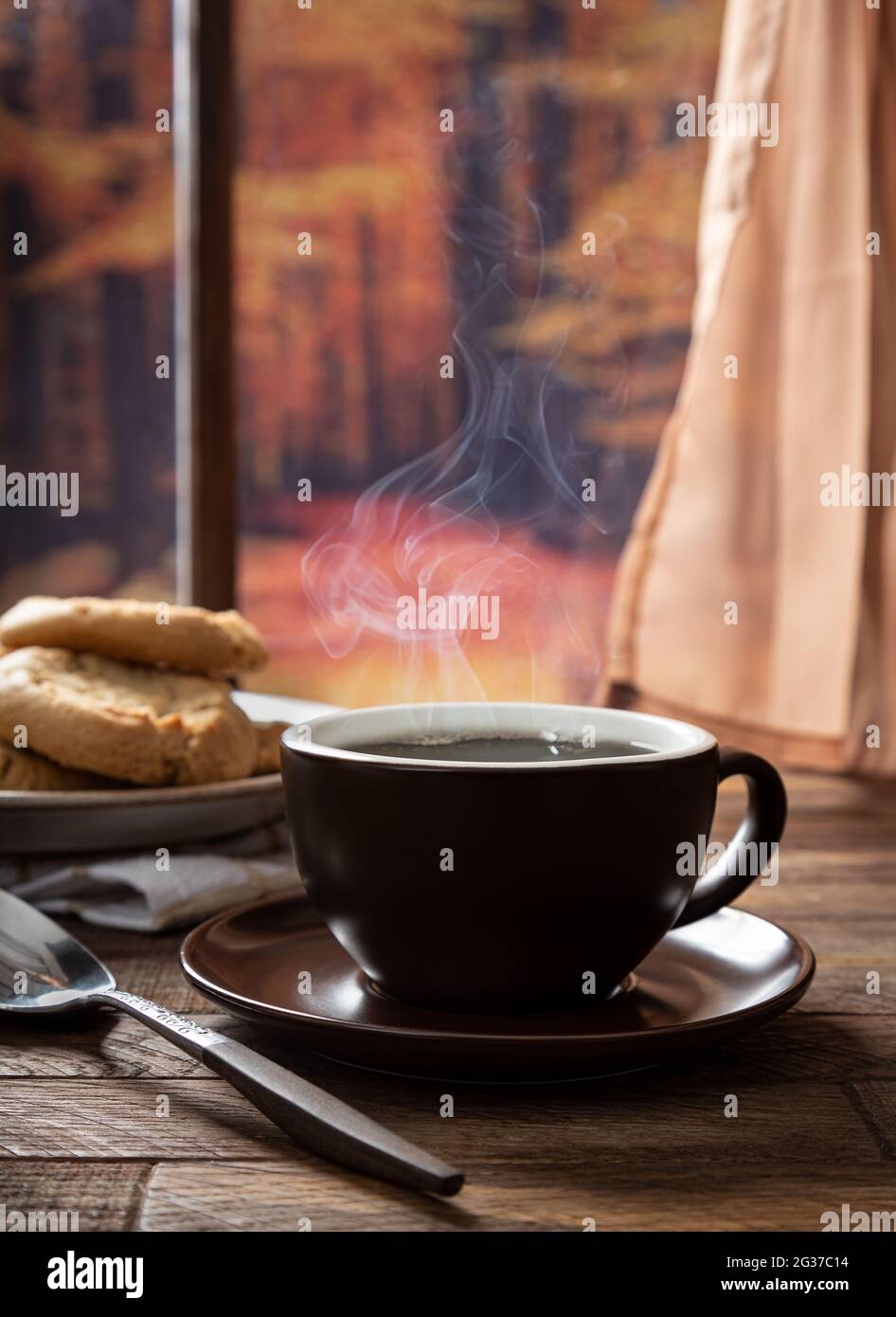Cup of hot coffee on an old wooden table. Stock Photo by ©Valentyn_Volkov  54495007