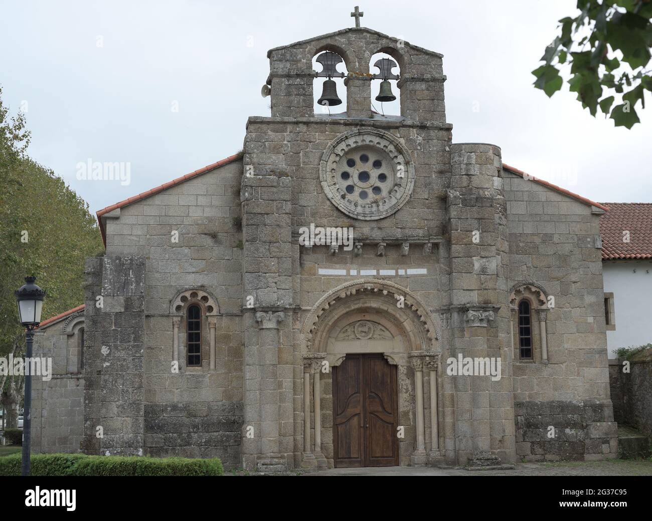 Spain, Galicia, La Coruña province, Cambre. Church of Santa Maria. Built in the 12th century in Romanesque style. View of the main facade. Stock Photo