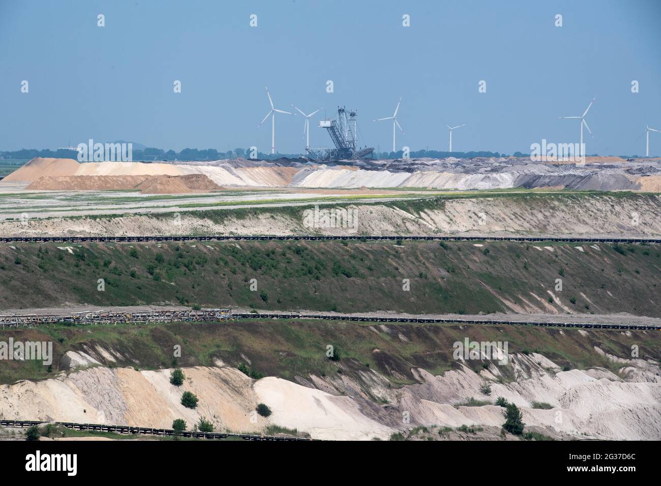 View Over The Inden Opencast Mine In The Background Wind Turbines And A Spreader The Energy Company Rwe Is Planning A Solar Power Plant With Battery Storage On The Site Of The