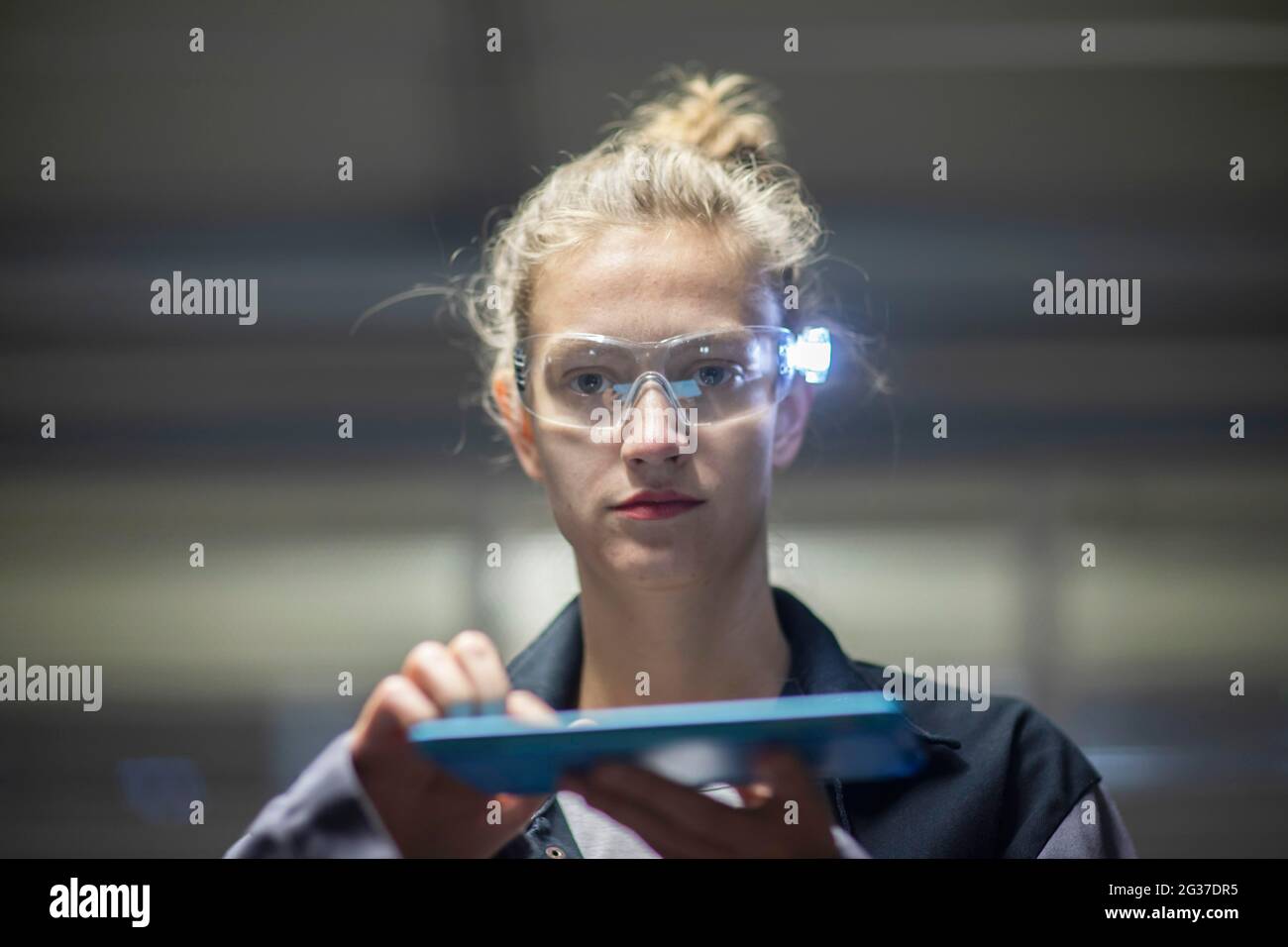 Young logistician working with scan glasses, Freiburg, Baden-Wuerttemberg, Germany Stock Photo