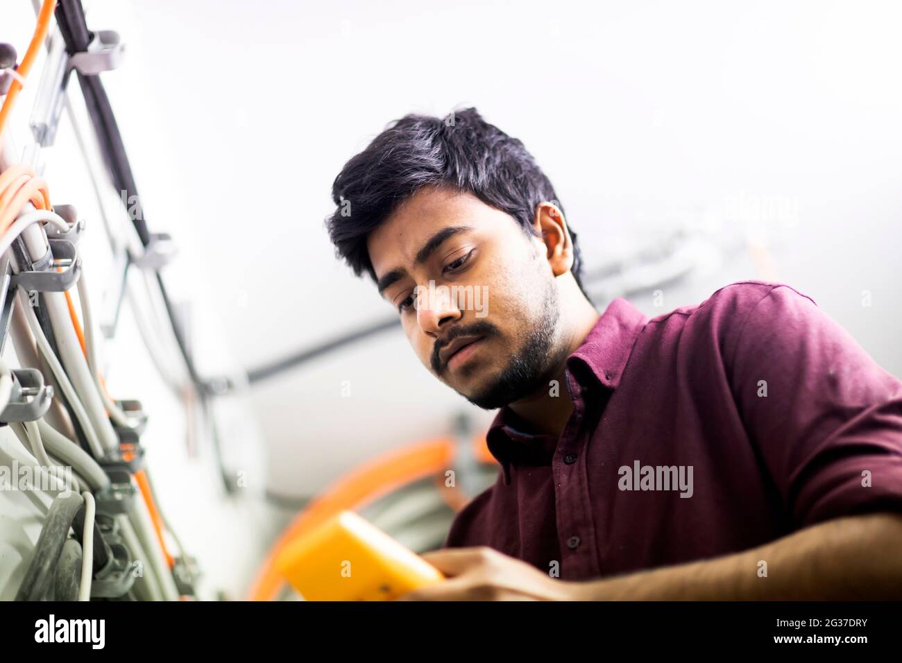 Young technician at work, Baden-Wuerttemberg, Germany Stock Photo