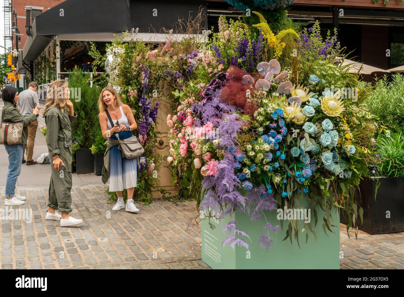 Visitors crowd the L.E.A.F. Festival of Flowers in the Meatpacking