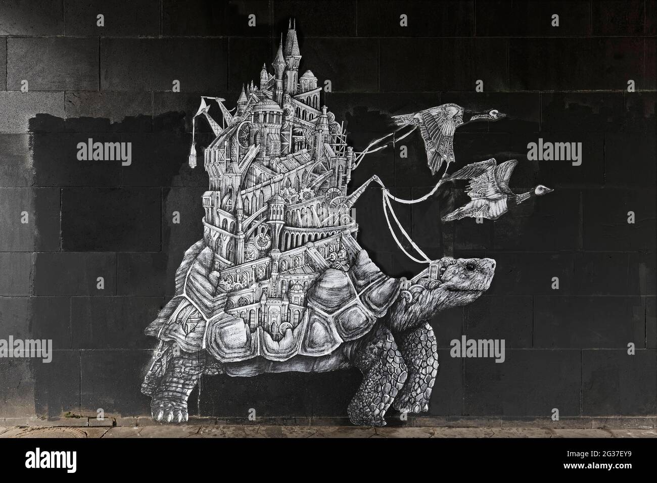 Paste up, turtle carries machine city on shell, symbol for balance of nature and technology, surreal picture, mechanimal by streetart artist Ardif Stock Photo