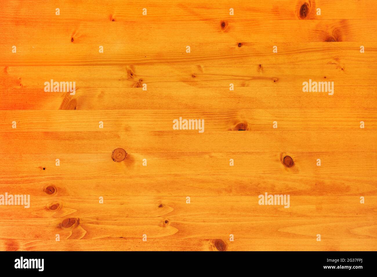 Pinewood board surface as background, texture of wooden planks with wood knots, top down image Stock Photo