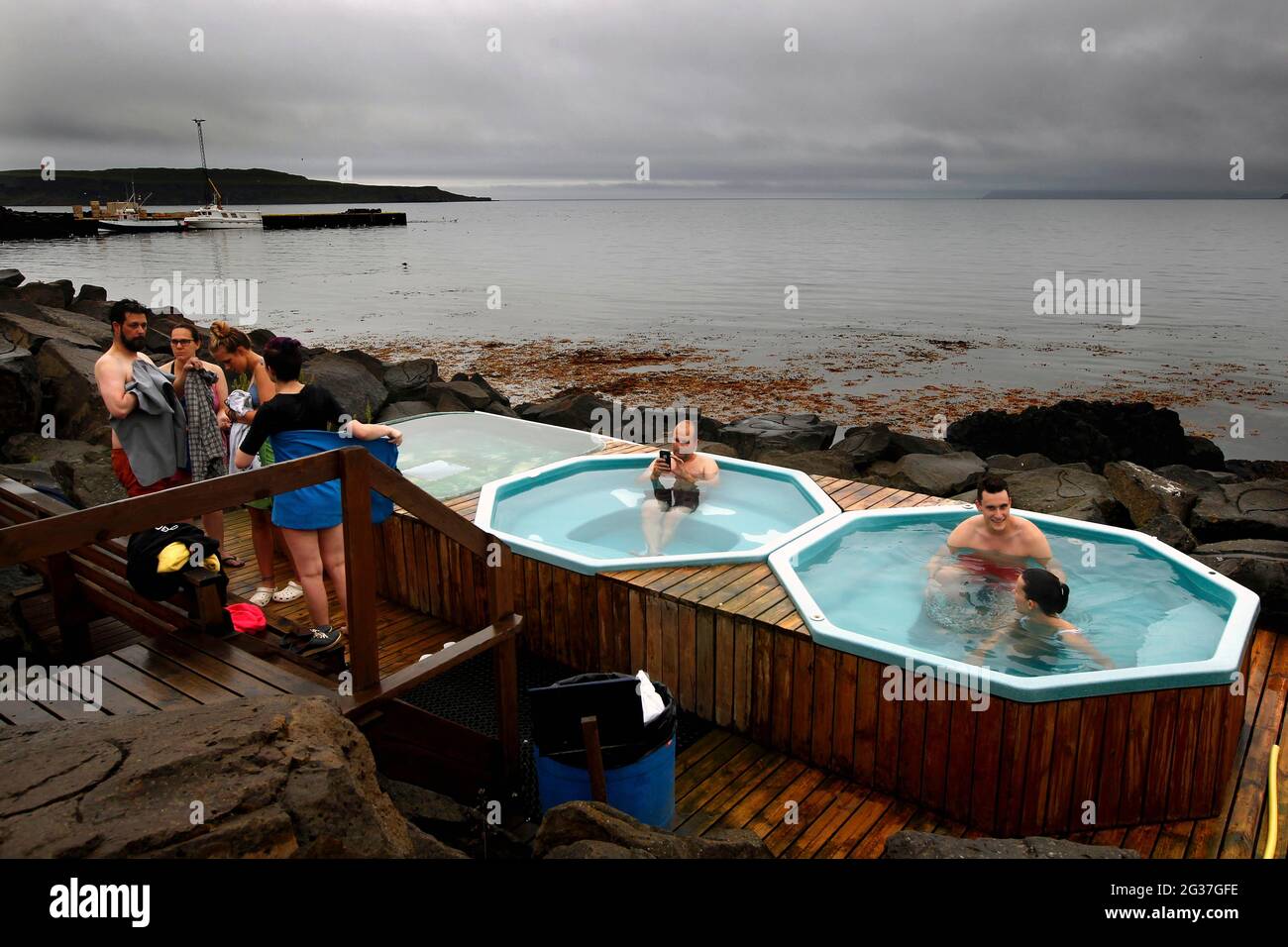 People in the Hot Pot, Geothermal Bath at the Atlantic Ocean, Drangsnes