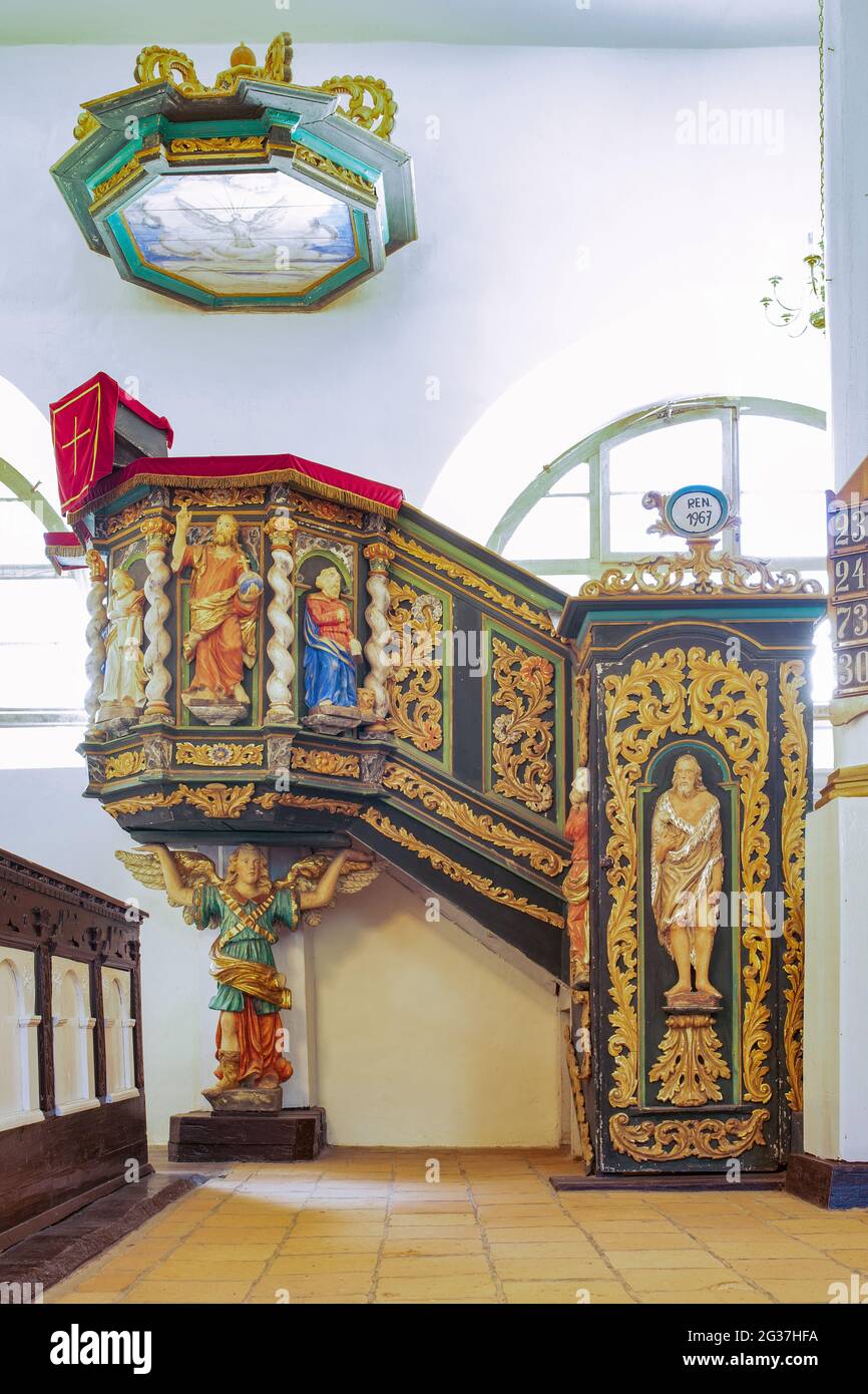 Sorkwity, Poland - Interior of an old Evangelic church. Richly ornamented altars, stalls, pulpit. Stock Photo