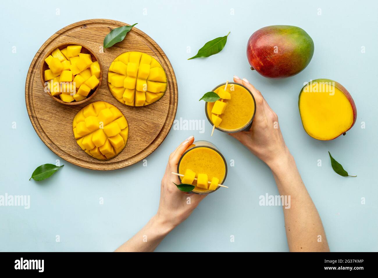 Mango slices and cubes with fresh mango smoothie. Top view Stock Photo