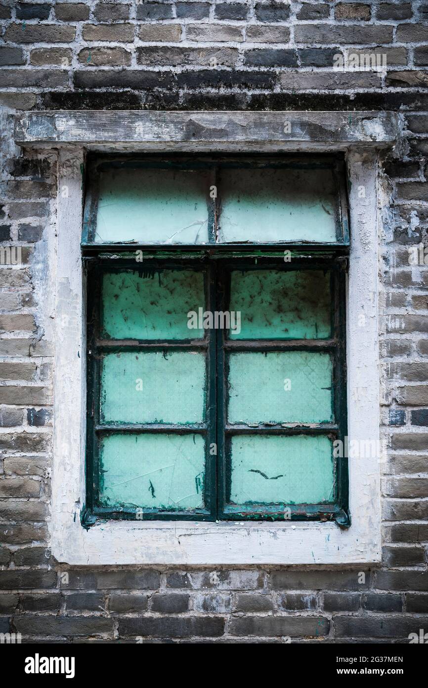 A window in a traditional green brick village house in Kam Tin, New Territories, Hong Kong (Set: #1 of 3) Stock Photo