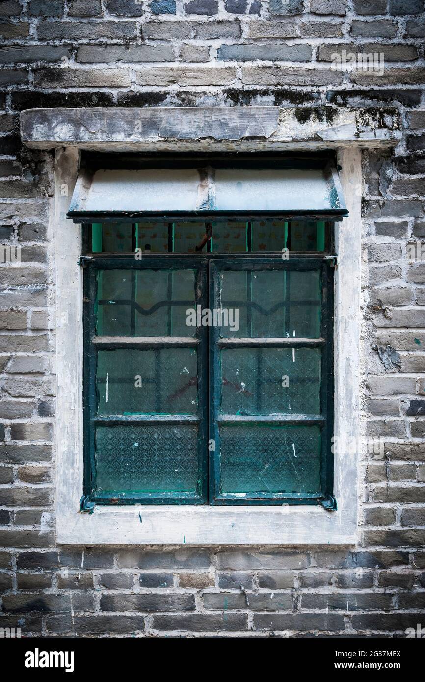A window in a traditional green brick village house in Kam Tin, New