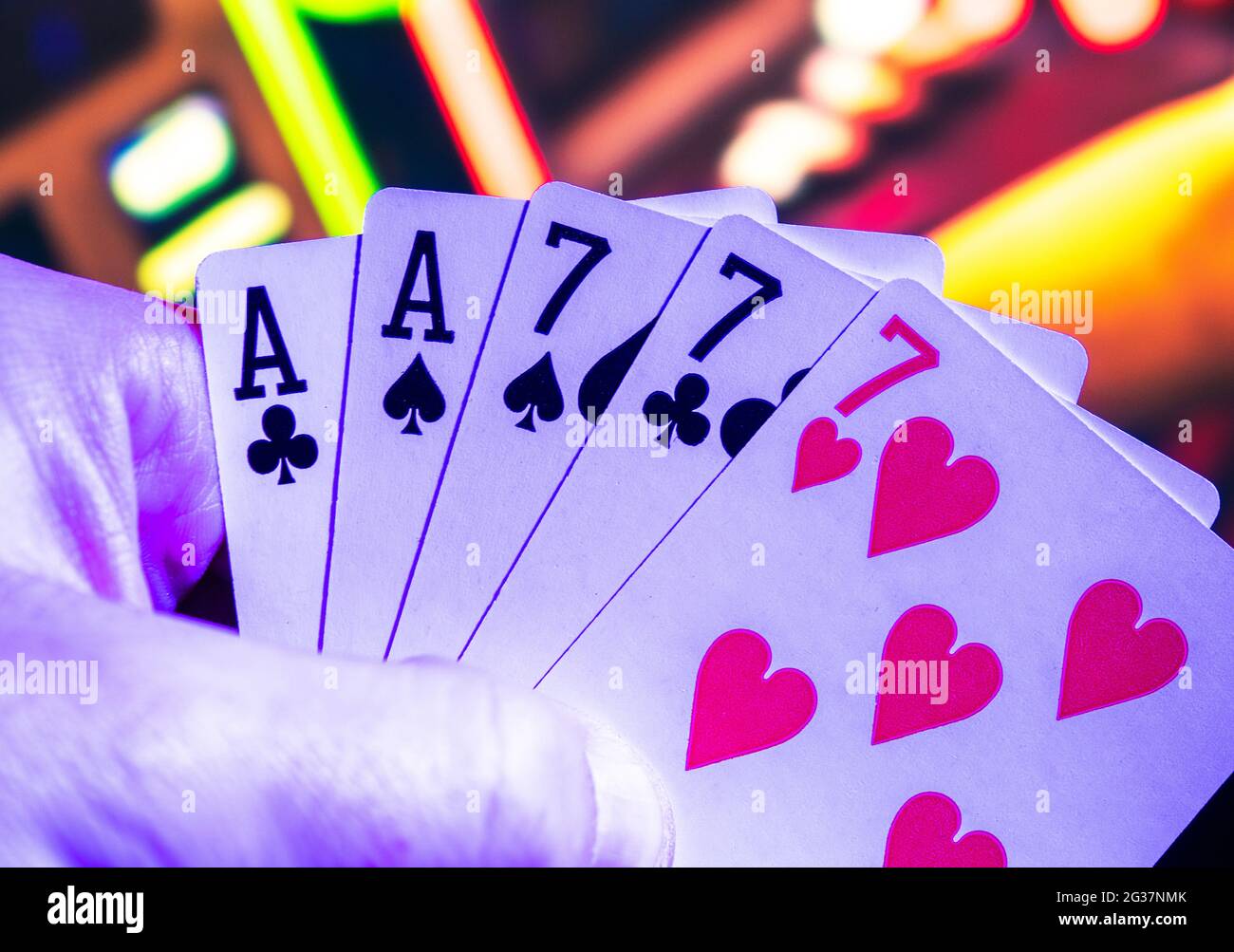 Full House in Poker Game. Gaming Cards in Gamblers Hand. Stock Photo