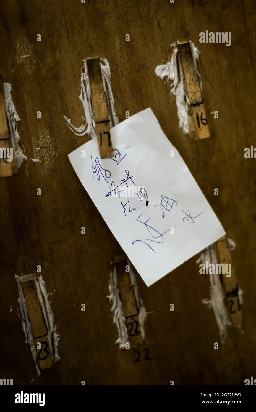 A last order still hangs on a peg in an abandoned restaurant, Ngong Ping, Lantau Island, Hong Kong Stock Photo
