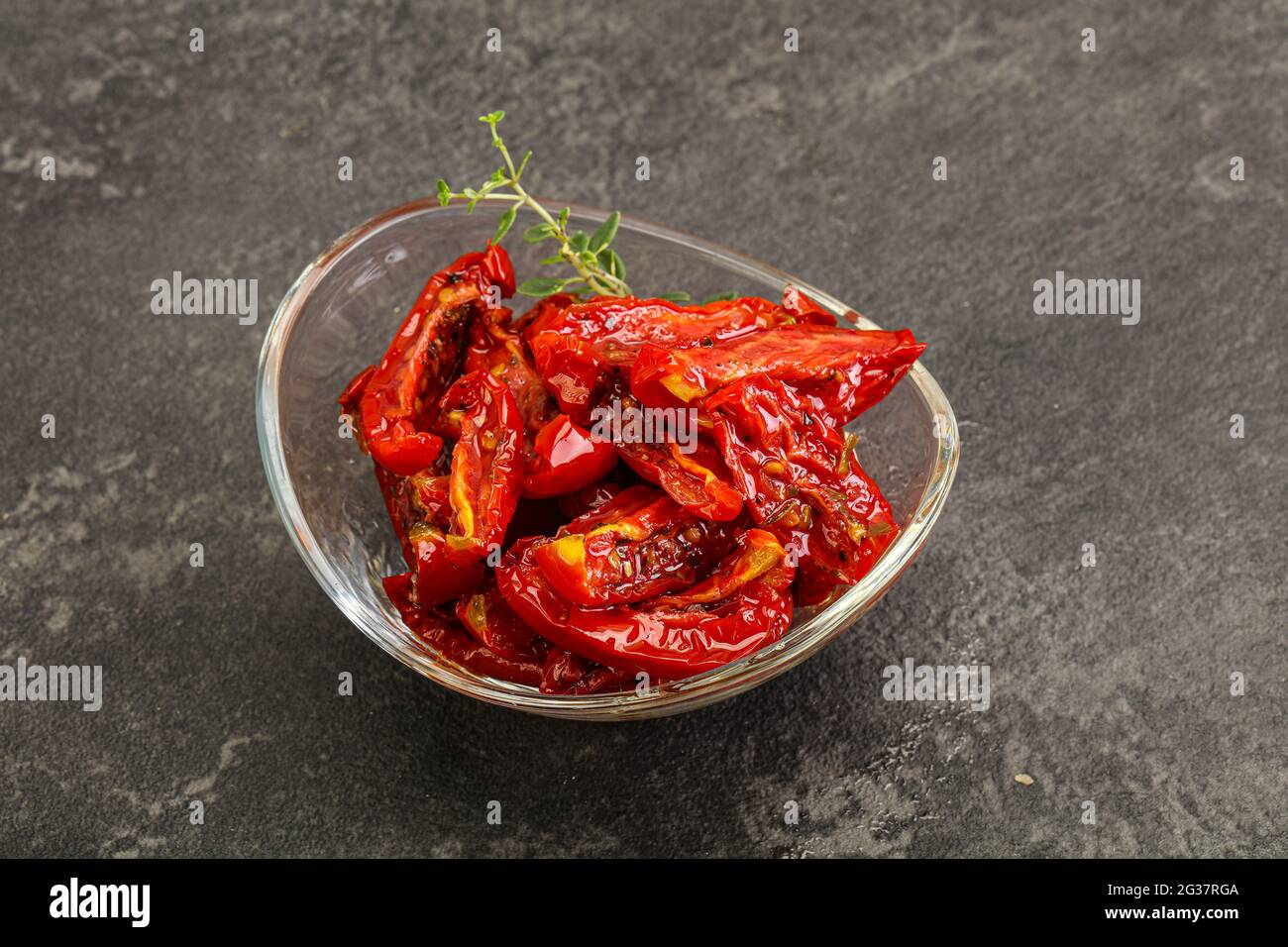 Sundried tomato in olive oil with herbs and spices Stock Photo Alamy