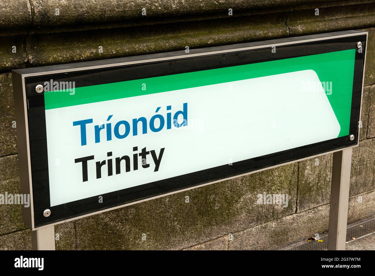 Trinity LUAS stop bilingual sign, Dublin, Ireland Stock Photo