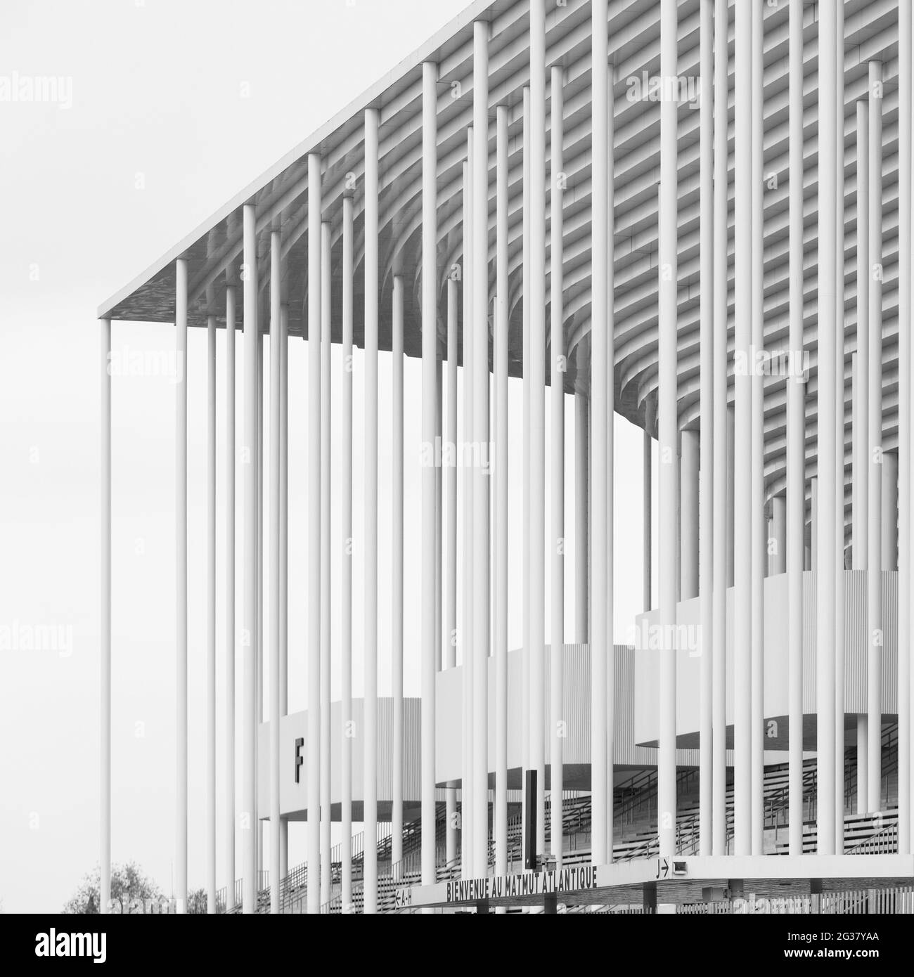 Vertical grayscale shot of architectural details of Matmut Atlantique Stadium in Bordeaux, France Stock Photo