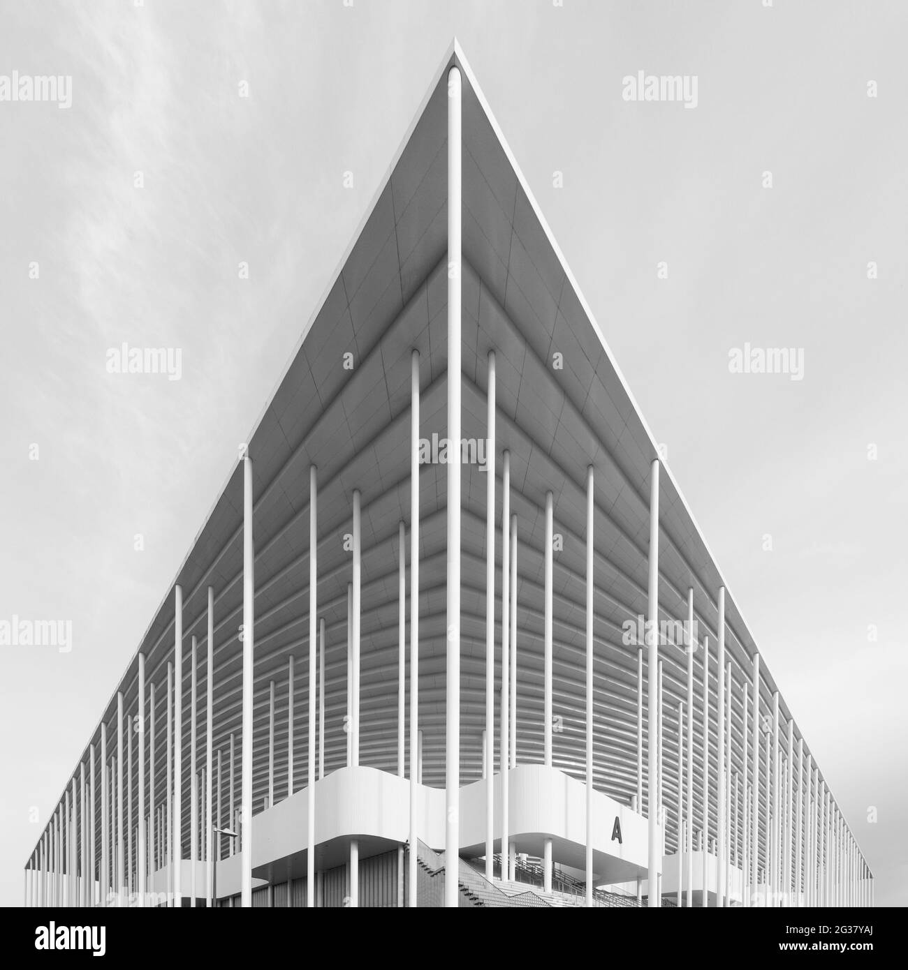 Vertical grayscale shot of architectural details of Matmut Atlantique Stadium in Bordeaux, France Stock Photo