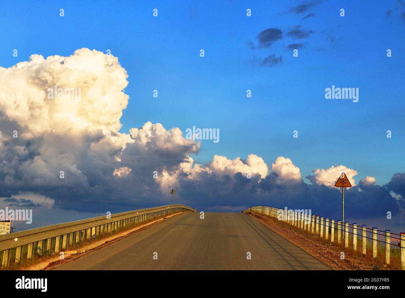 Road with clouds. Stock Photo