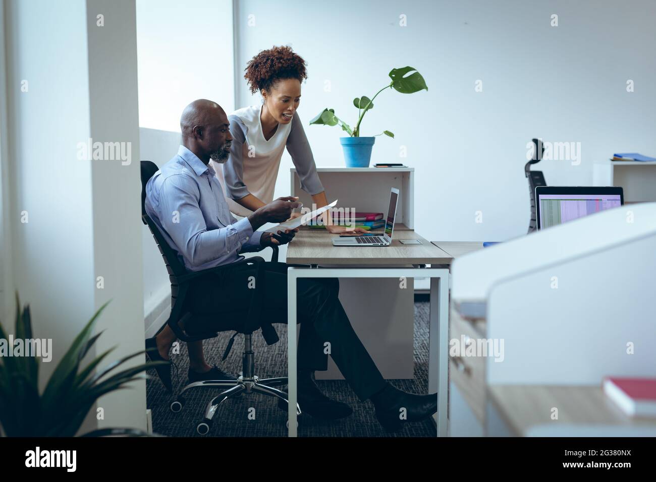 Two colleagues at desk hi-res stock photography and images - Alamy
