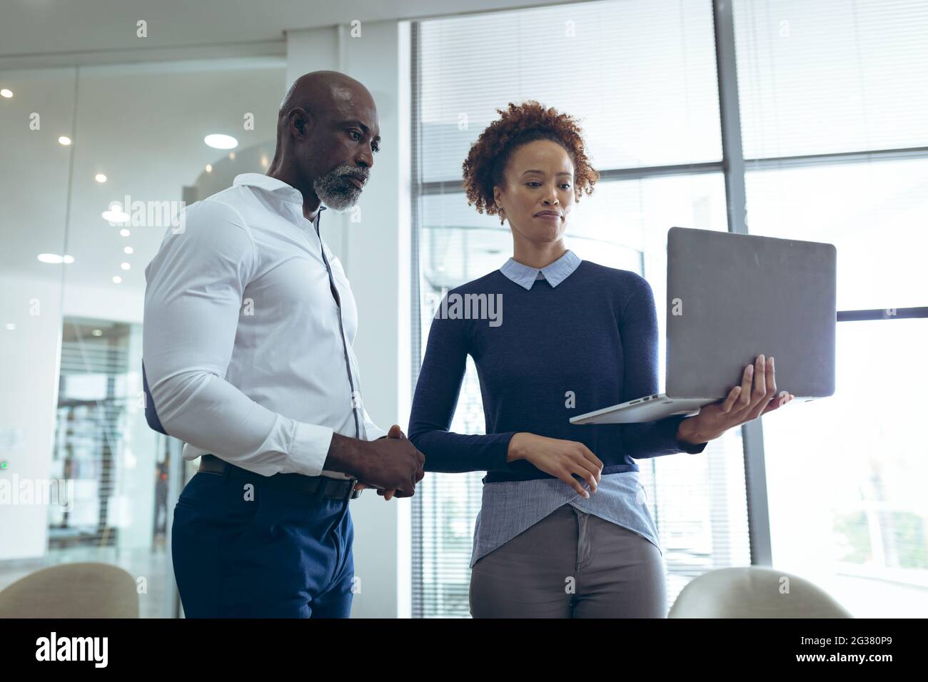 Diverse male female colleagues standing hi-res stock photography and ...