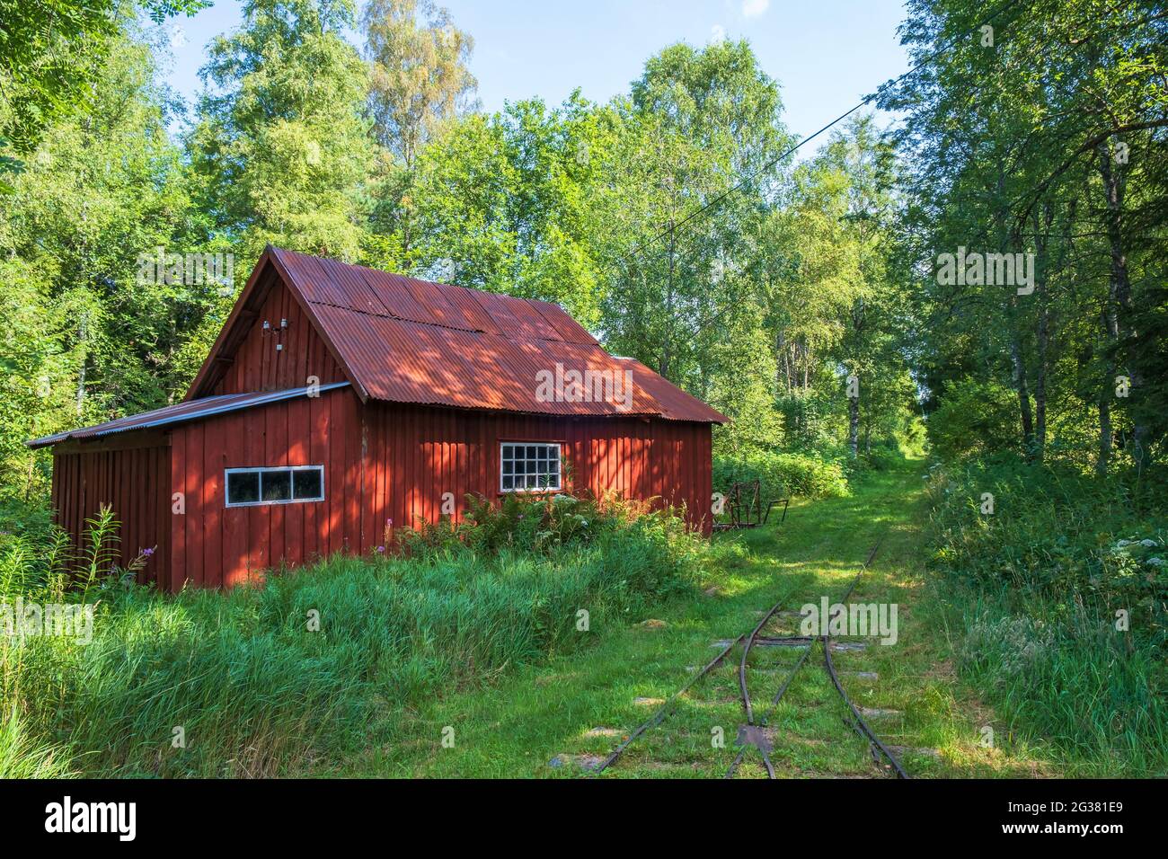 Old red shed at a light railway in the forest Stock Photo