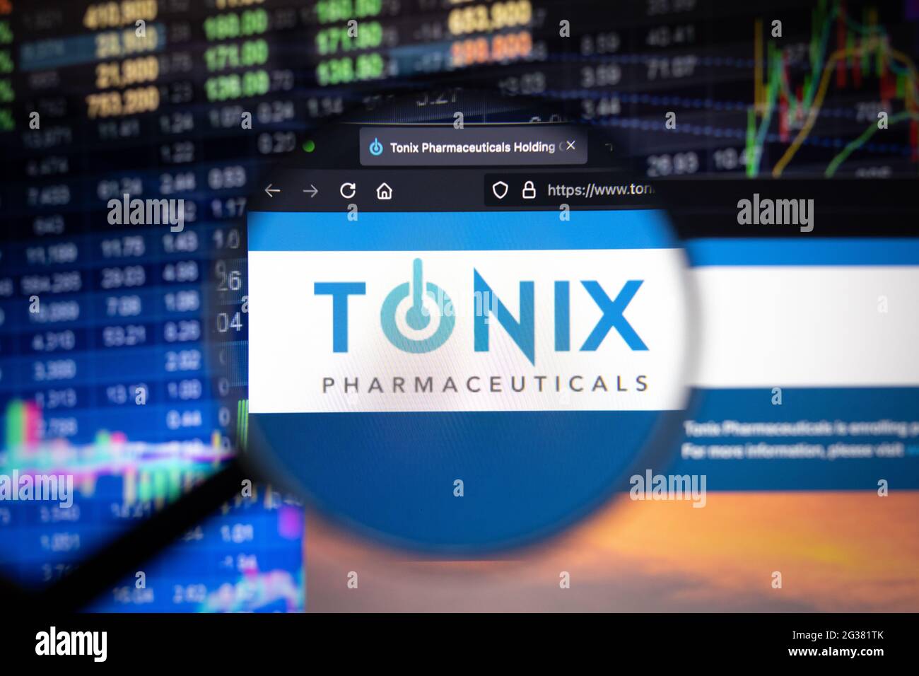 Tonix Pharmaceuticals company logo on a website with blurry stock market developments in the background, seen on a computer screen Stock Photo