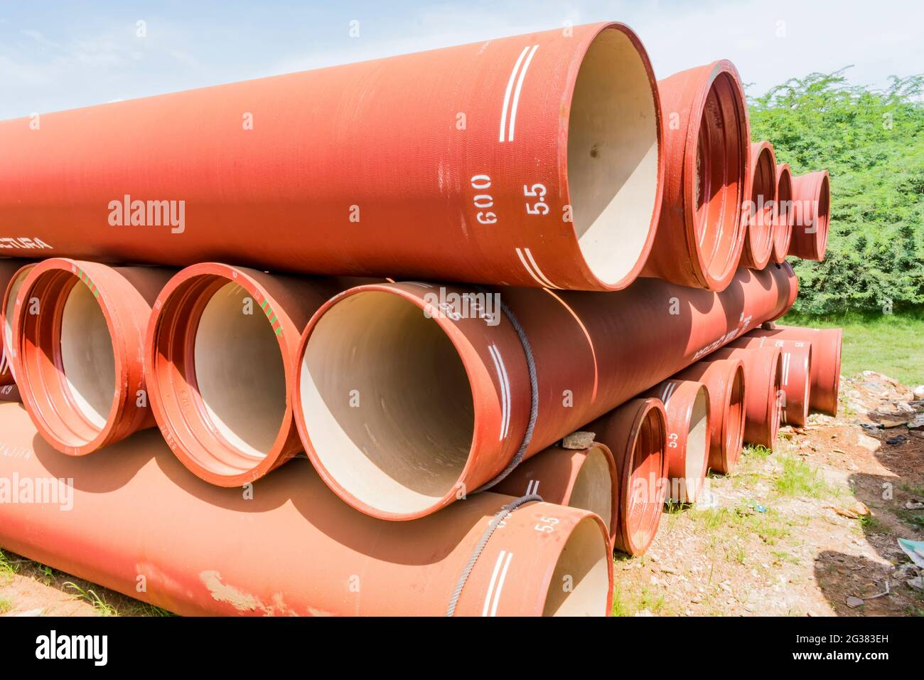 ductile iron pipes stocked in open space of a rural village store yard. Stock Photo