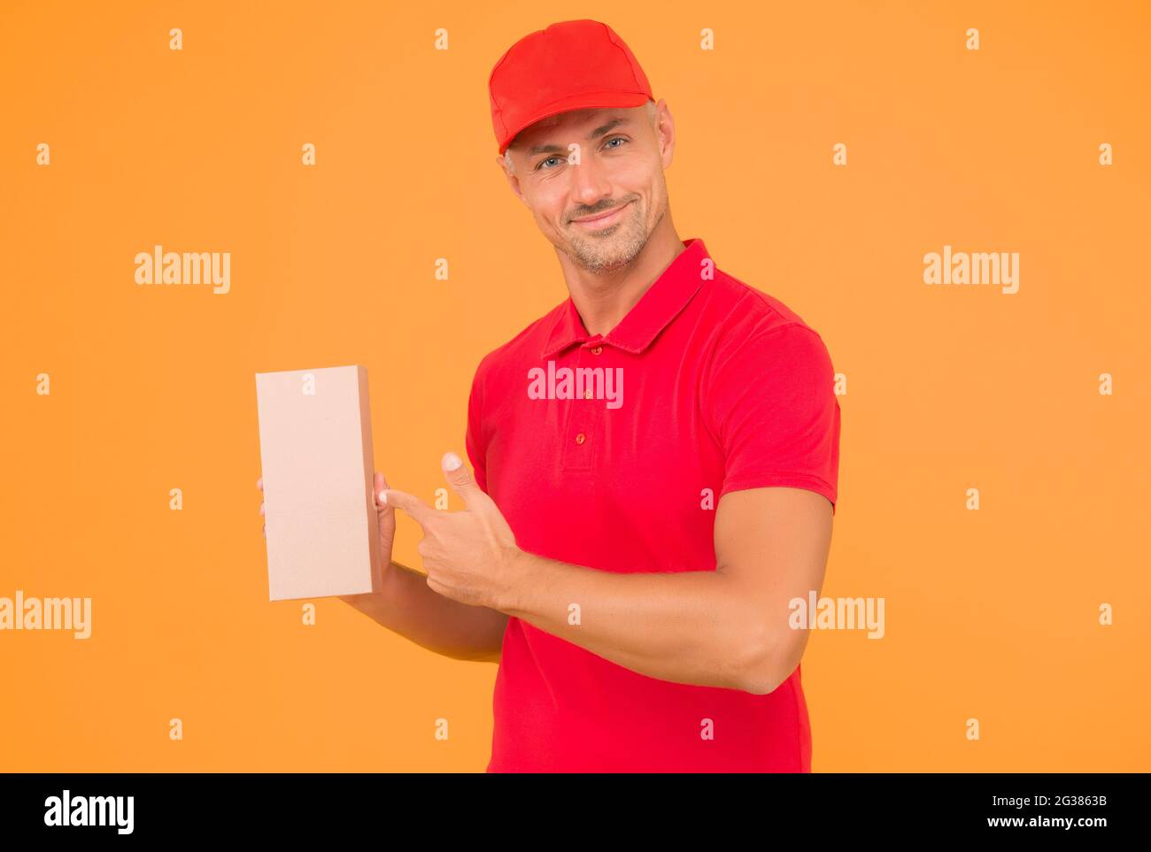 Your parcel our passion. Courier guy point finger at parcel box ...