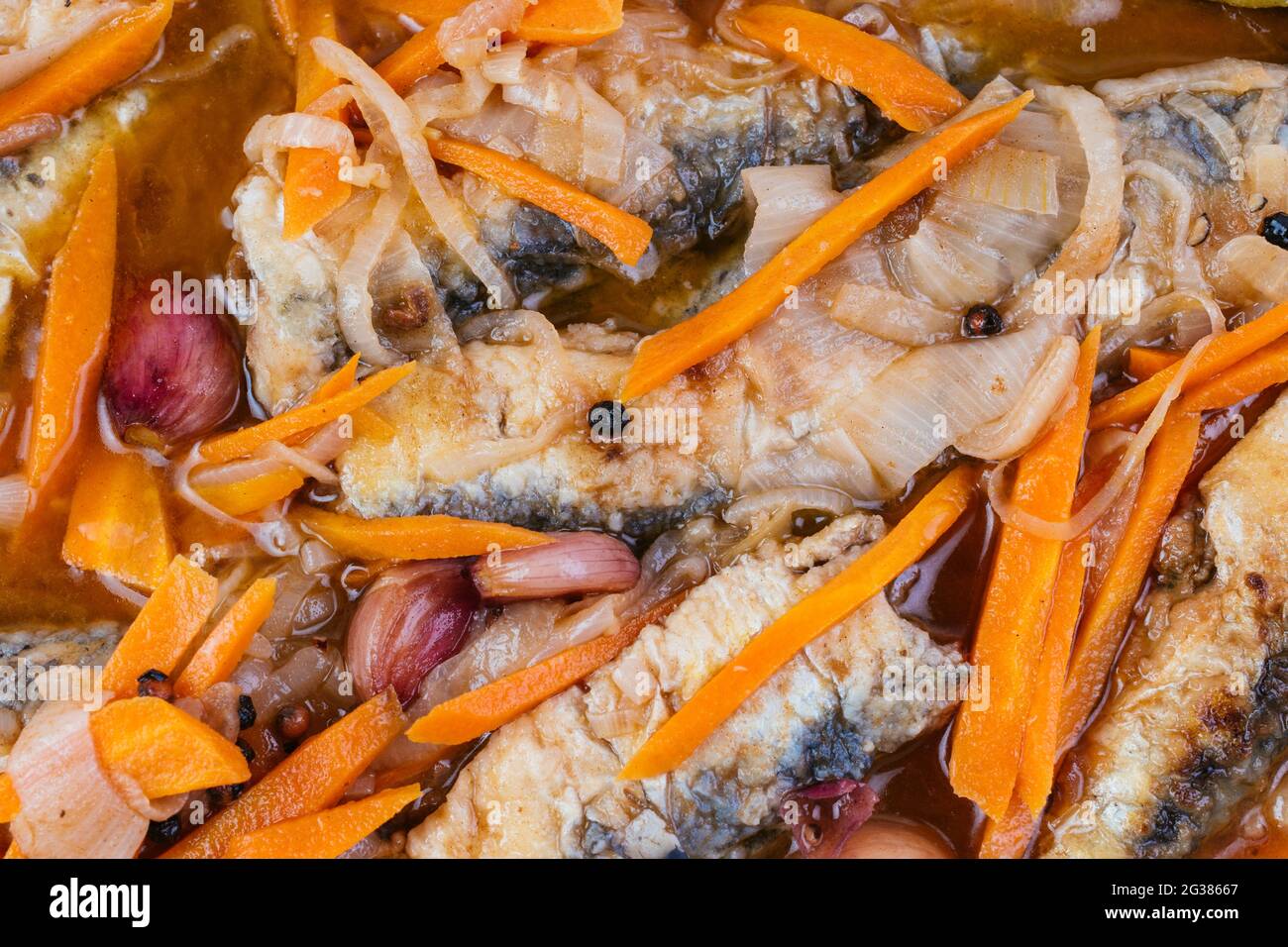 Typical Andalusian food. Sardines in escabeche - Pickled sardines. Escabeche is the name for a number of dishes in Spanish, consisting of marinated fi Stock Photo