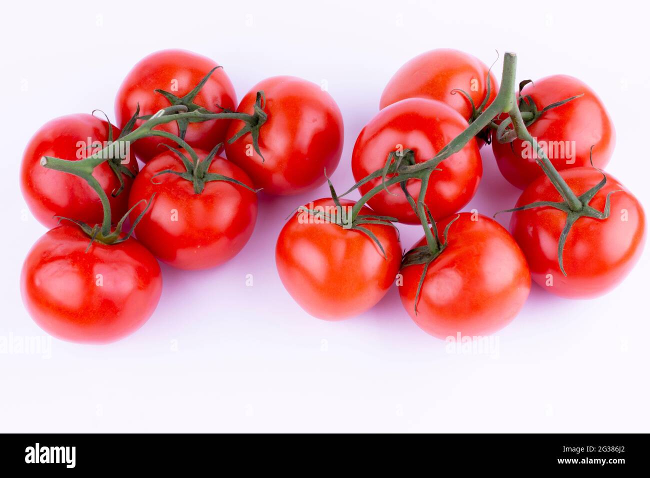 Red Tomato with Stem. The tomato is the edible berry of the plant Solanum lycopersicum, commonly known as a tomato plant. Andalucia, Spain, Europe Stock Photo