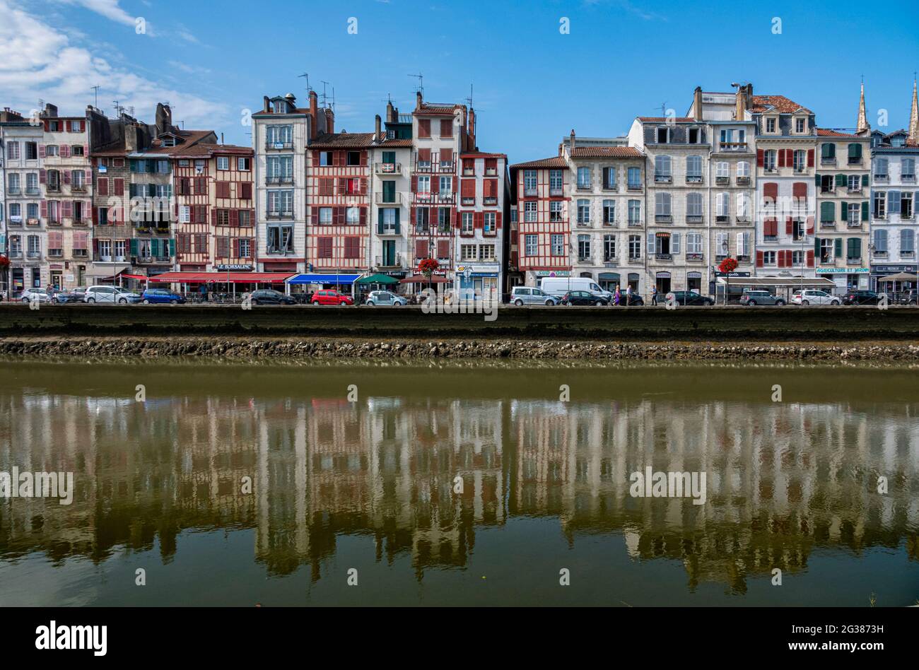 Traditional facades with colorful windows in Bayonne, Basque Country, France Stock Photo