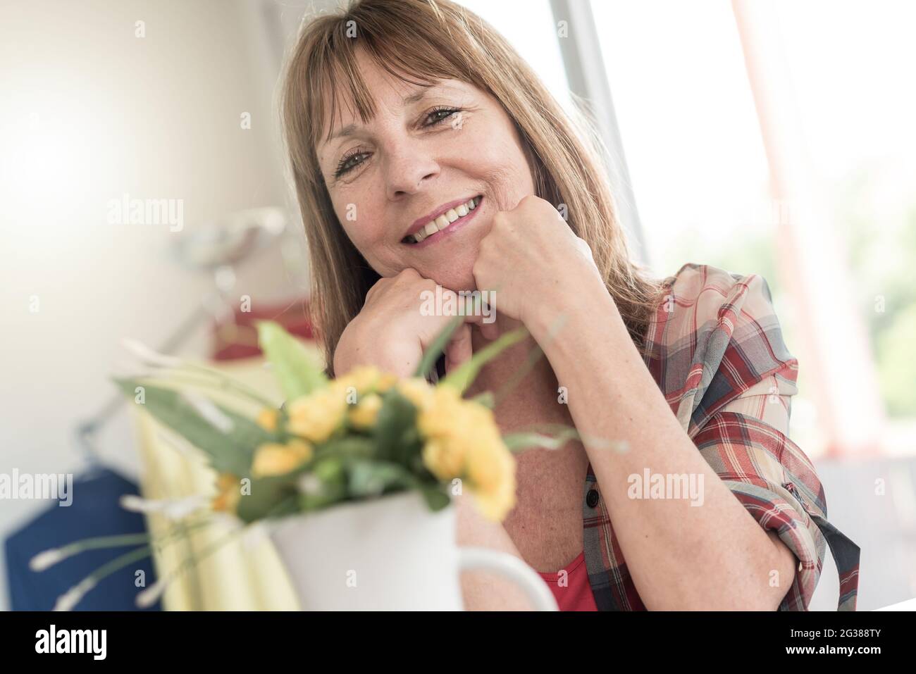 Portrait of smiling mature woman at home Stock Photo - Alamy