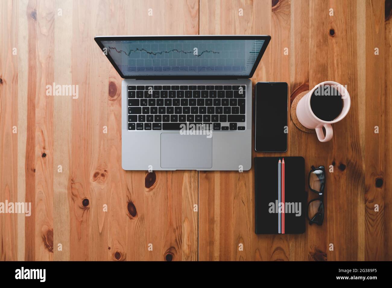 laptop, notepad, smartphone and coffee on wooden table Stock Photo - Alamy