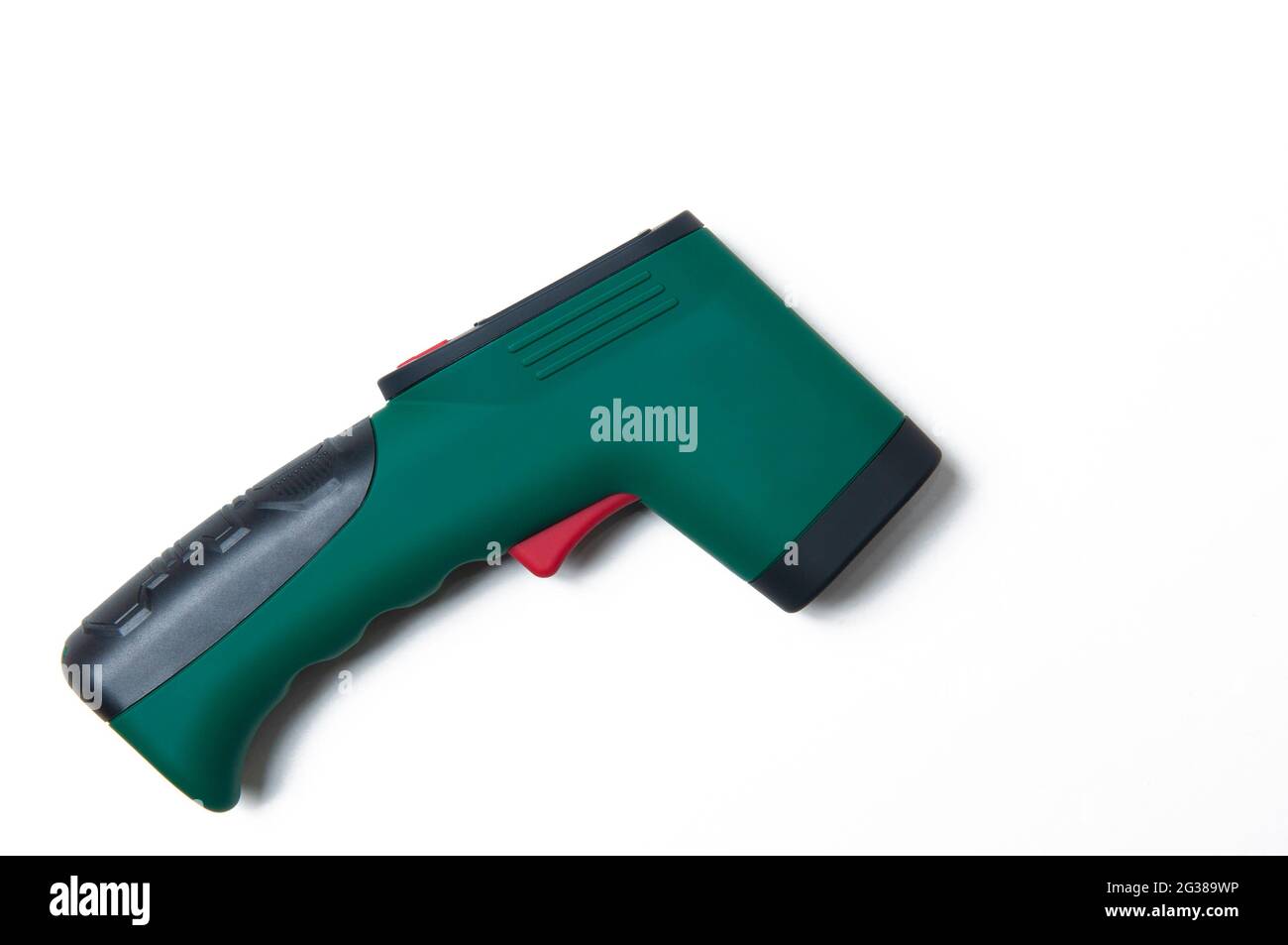 Dark green and black infrared thermometer on white background, from above, used without contact. Copy, text space. Stock Photo