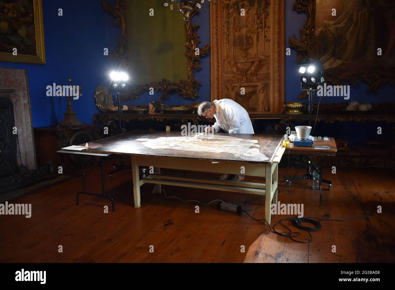 Peter Vogel restoring painting by A. Ramsey of King George III. Bantry, Co Cork. Ireland Stock Photo