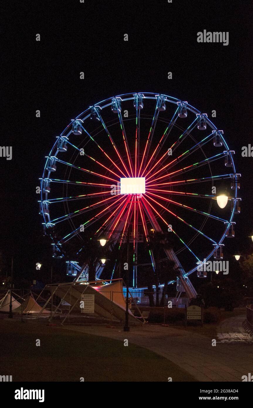 Ferris wheel in an amusement park at night Stock Photo - Alamy