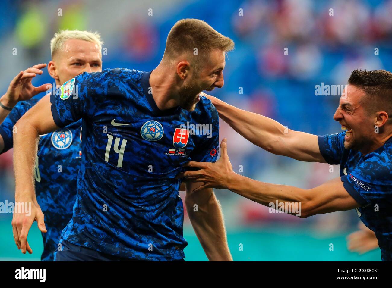 14 June 2021, Russia, St. Petersburg: Football: European Championship, Poland - Slovakia, Preliminary round, Group E, Matchday 1 at St. Petersburg Stadium. Milan Skriniar of Slovakia (centre) celebrates with Ondrej Duda of Slovakia and Robert Mak of Slovakia (right) after scoring to make it 1:2.Important: For editorial news reporting purposes only. Not used for commercial or marketing purposes without prior written approval of UEFA. Images must appear as still images and must not emulate match action video footage. Photographs published in online publications (whether via the Internet or other Stock Photo