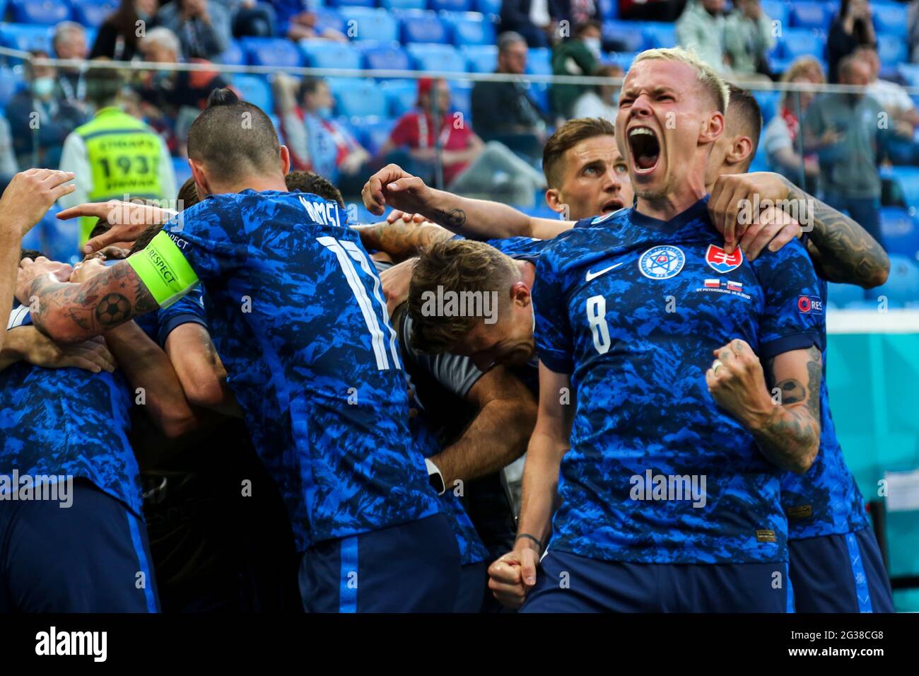 14 June 2021, Russia, St. Petersburg: Football: European Championship, Poland - Slovakia, preliminary round, Group E, matchday 1 at St. Petersburg Stadium. Slovakia's Ondrej Duda (r) celebrates his goal to make it 1:2.Important: For editorial news reporting purposes only. Not used for commercial or marketing purposes without prior written approval of UEFA. Images must appear as still images and must not emulate match action video footage. Photographs published in online publications (whether via the Internet or otherwise) shall have an interval of at least 20 seconds between the posting. Photo Stock Photo