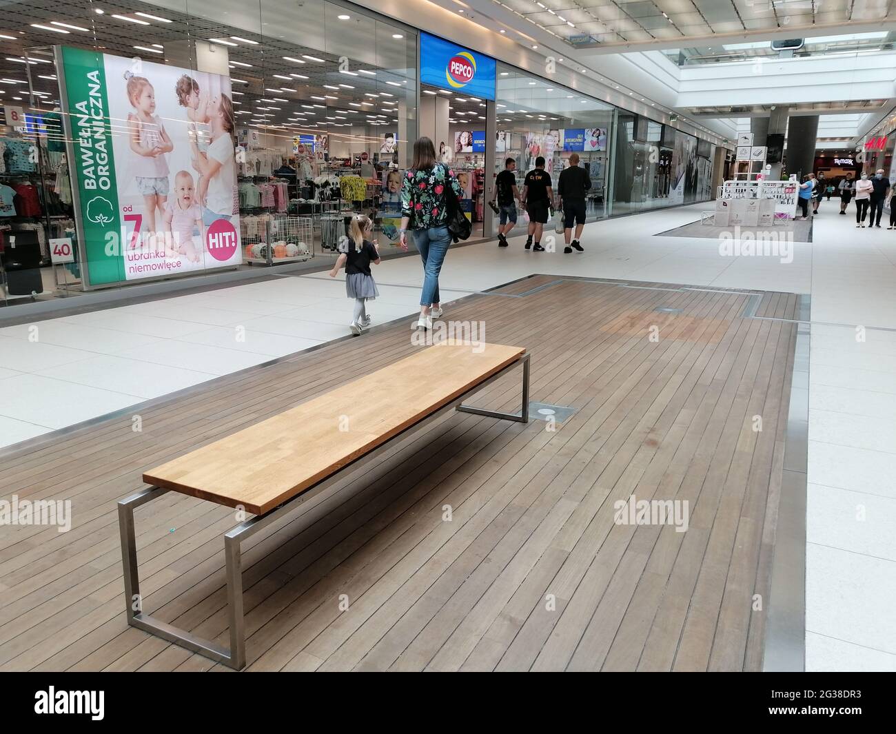 POZNAN, POLAND - Jun 12, 2021: Wooden bench in the Galeria Malta