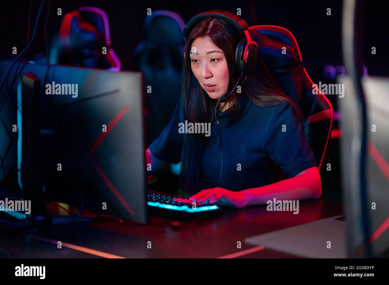 A young asian girl plays online video games in the evening in a computer  club Stock Photo - Alamy