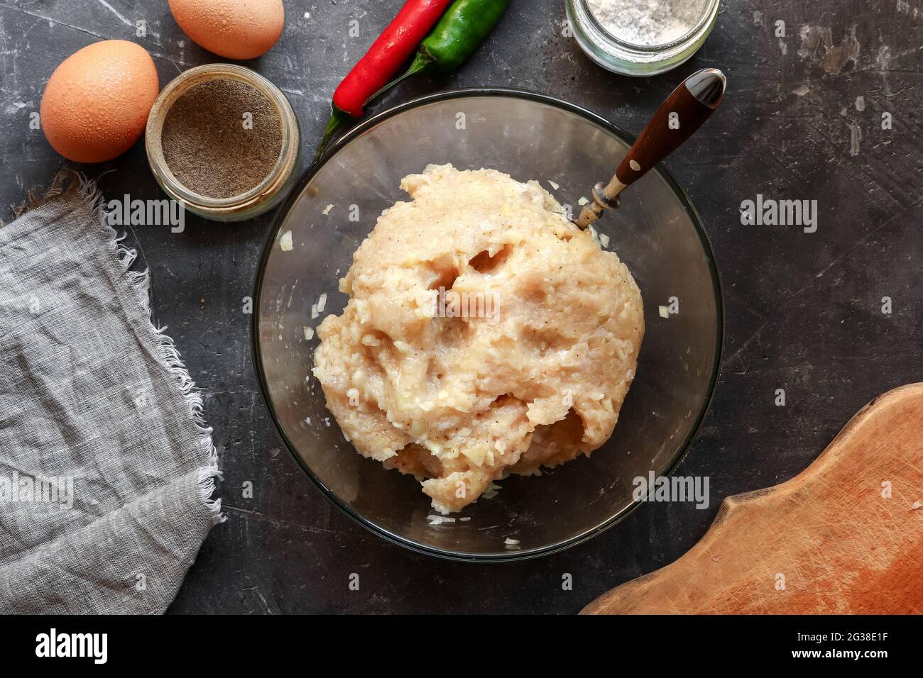 Step-by-step preparation of minced meat for chicken meatballs. Top view. Cooking in the kitchen. Recipe. Stock Photo