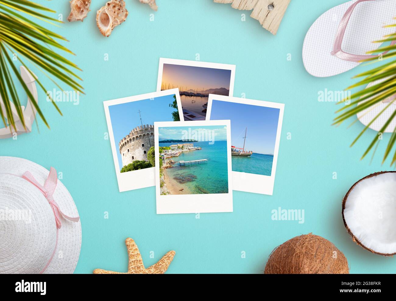 Travel photos surrounded by beach accessories concept. Top view, flat lay composition Stock Photo
