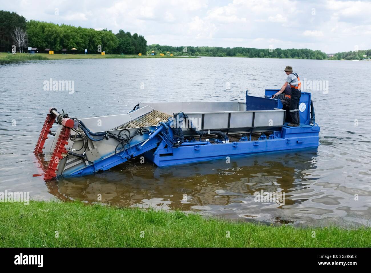 Weeding machine in water,Water hyacinth cleaning machine,The machine cuts and grinds weeds in the water to increase the amount of oxygen in the water. Stock Photo