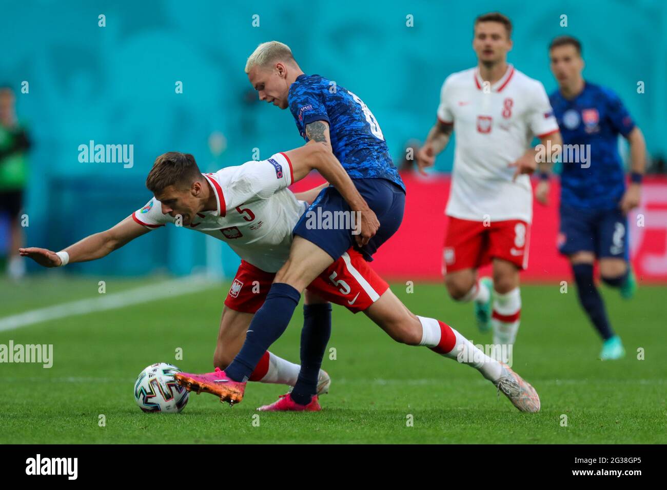 14 June 2021, Russia, St. Petersburg: Football: European Championship, Poland - Slovakia, Preliminary round, Group E, Matchday 1 at St. Petersburg Stadium. Poland's Jan Bednarek (l) and Slovakia's Ondrej Duda battle for the ball.Important: For editorial news reporting purposes only. Not used for commercial or marketing purposes without prior written approval of UEFA. Images must appear as still images and must not emulate match action video footage. Photographs published in online publications (whether via the Internet or otherwise) shall have an interval of at least 20 seconds between the pos Stock Photo