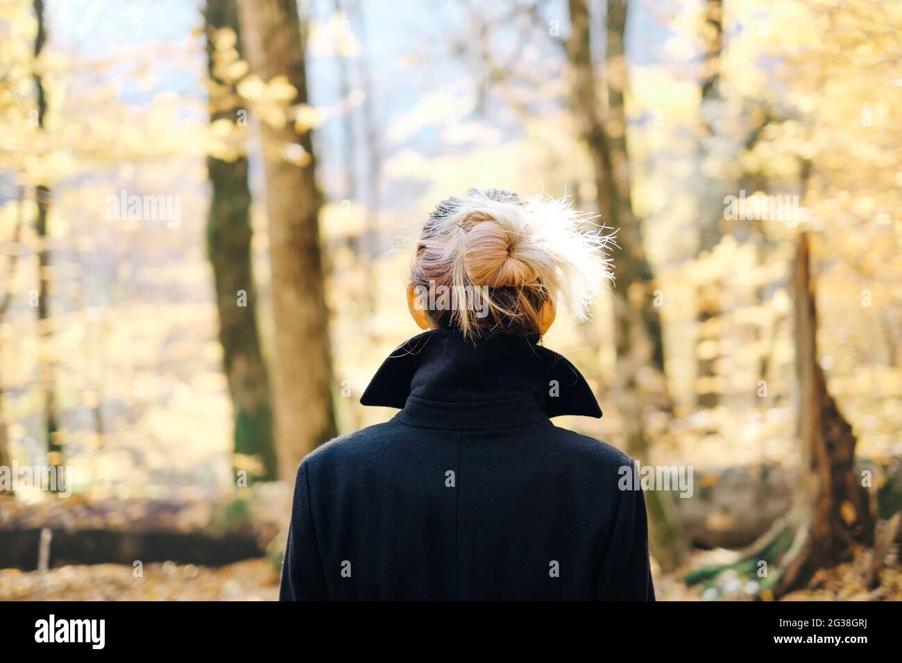 Woman walking coat hi-res stock photography and images - Alamy