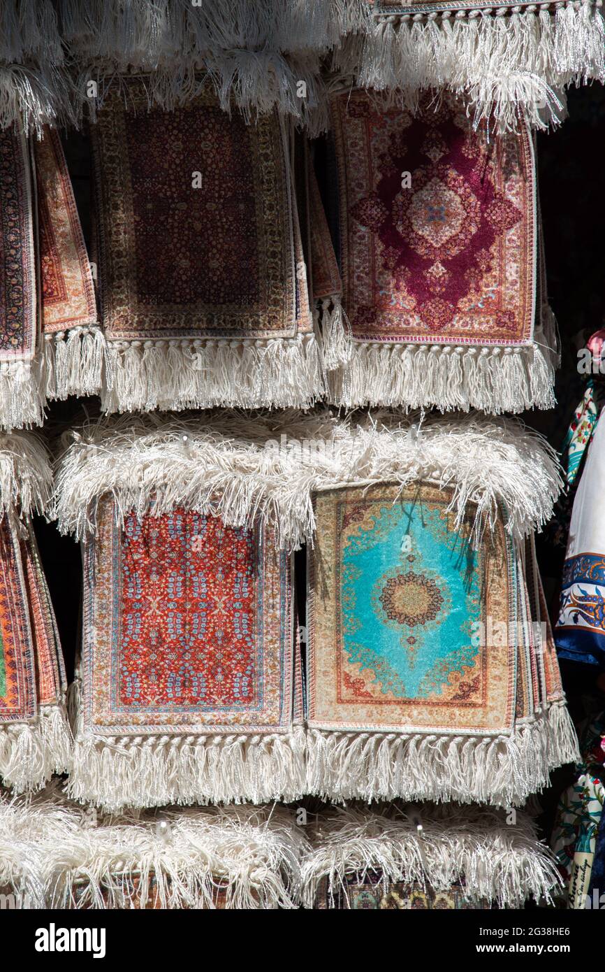 Vertical shot of various small prayer rugs at a souvenir shop Stock ...