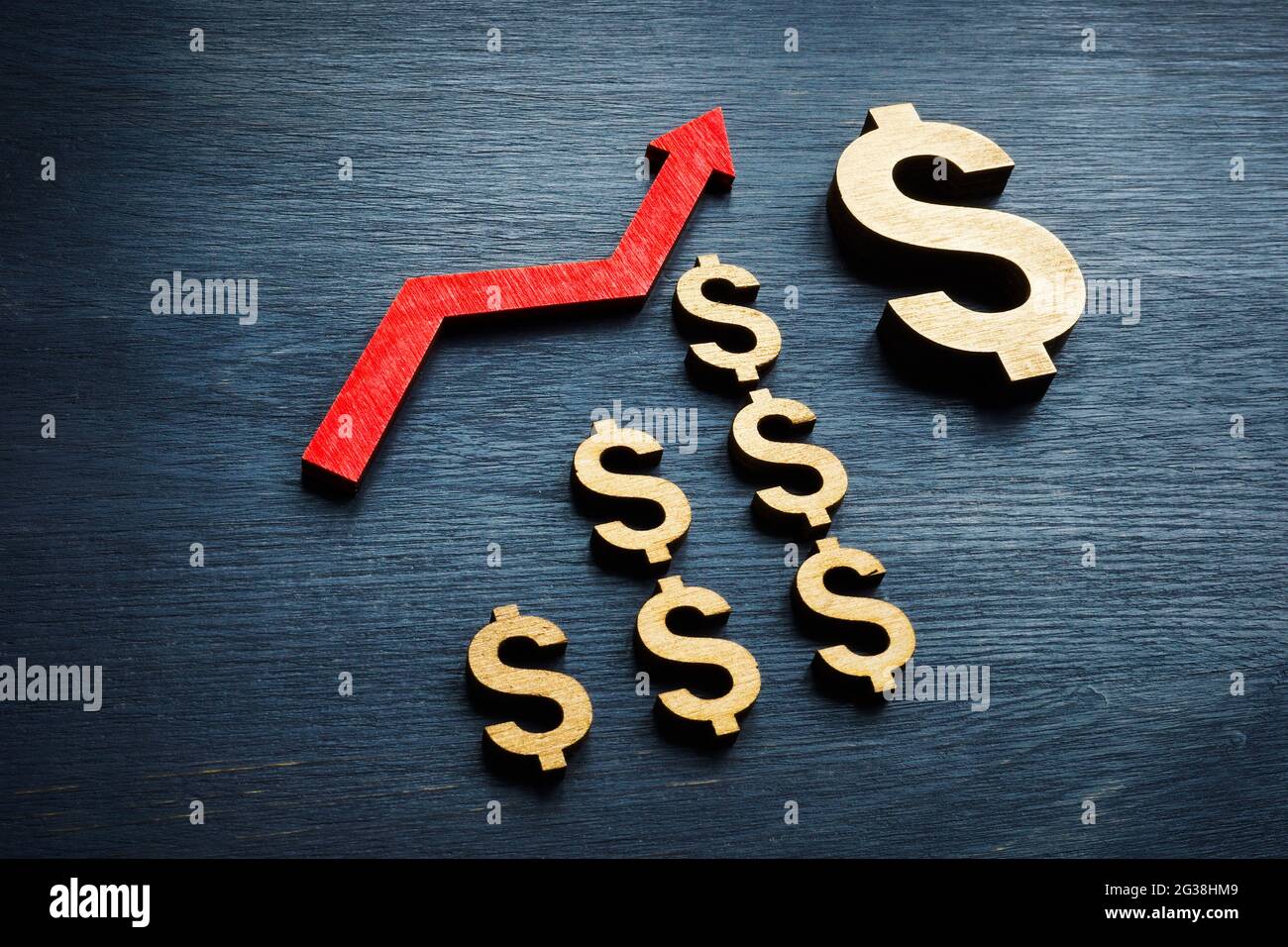 Success in investing and rise of savings. Dollar symbols and arrow. Stock Photo