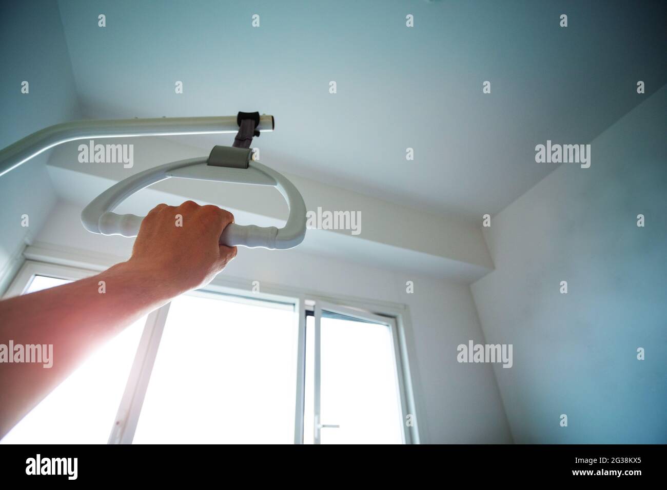 Hand hold handle hanging over bed in hospital Stock Photo Alamy