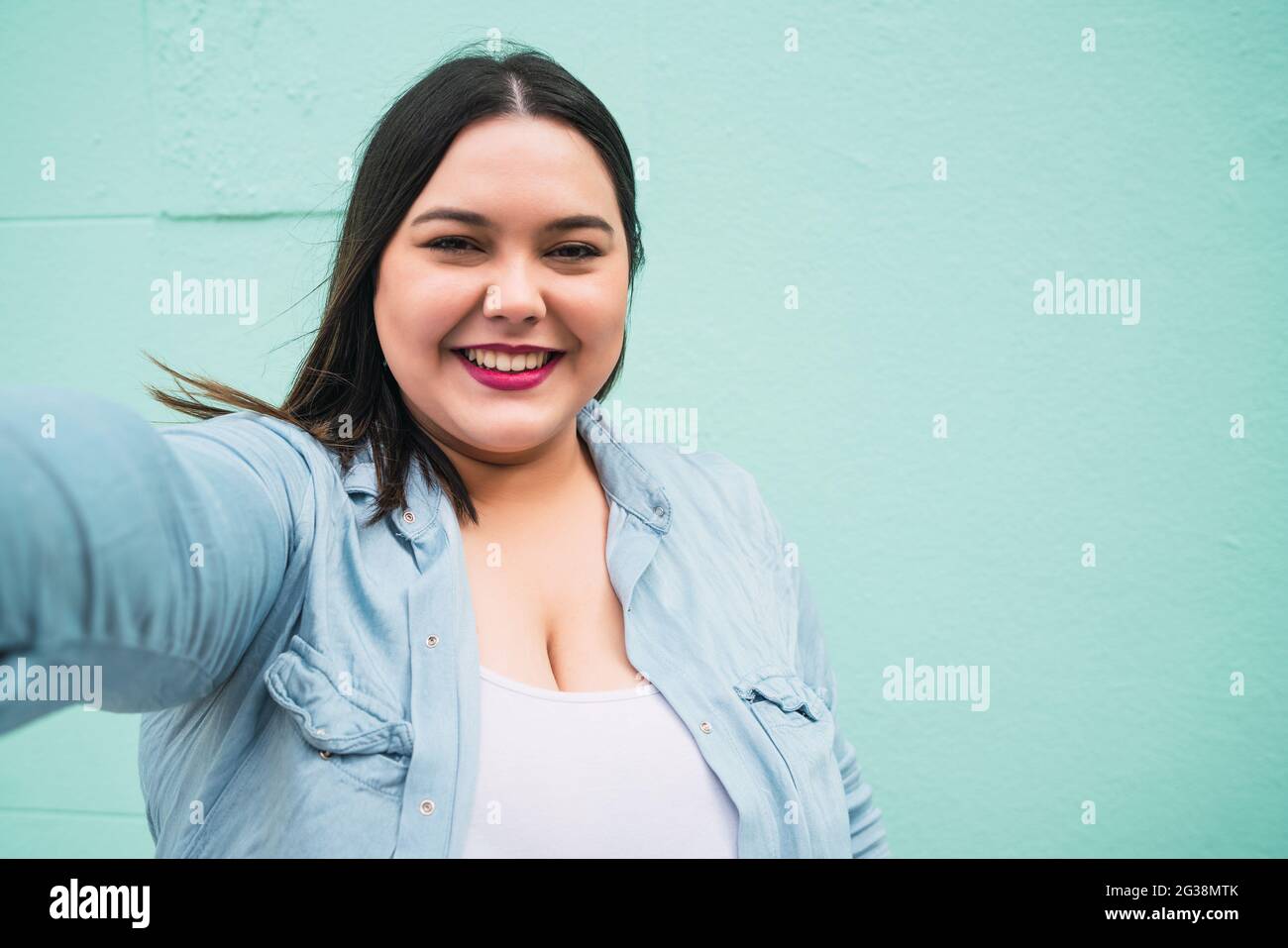 Plus size woman taking a selfie Stock Photo - Alamy