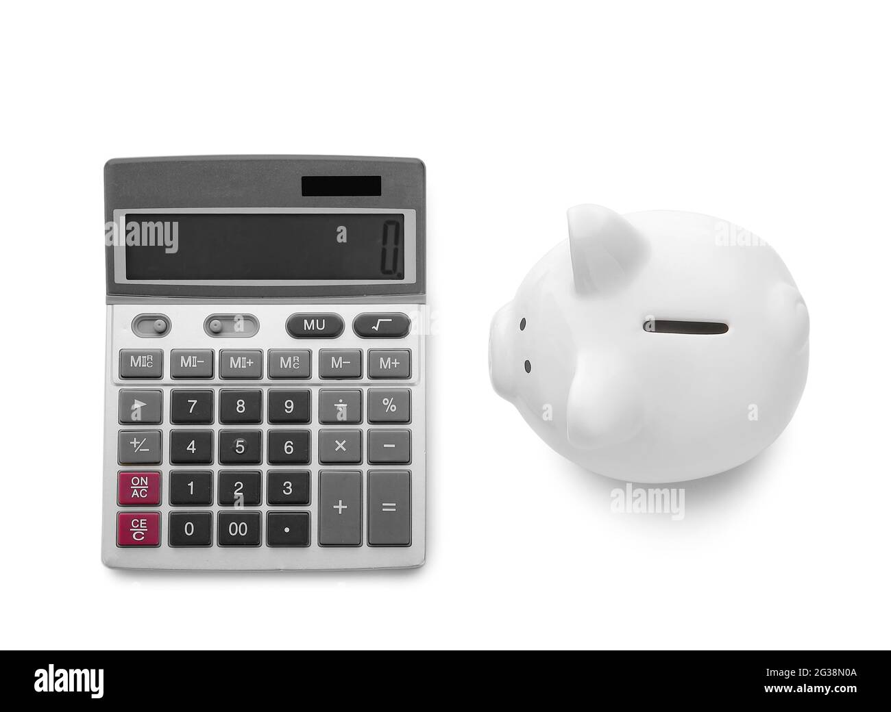 Calculator with piggy bank on white background Stock Photo - Alamy